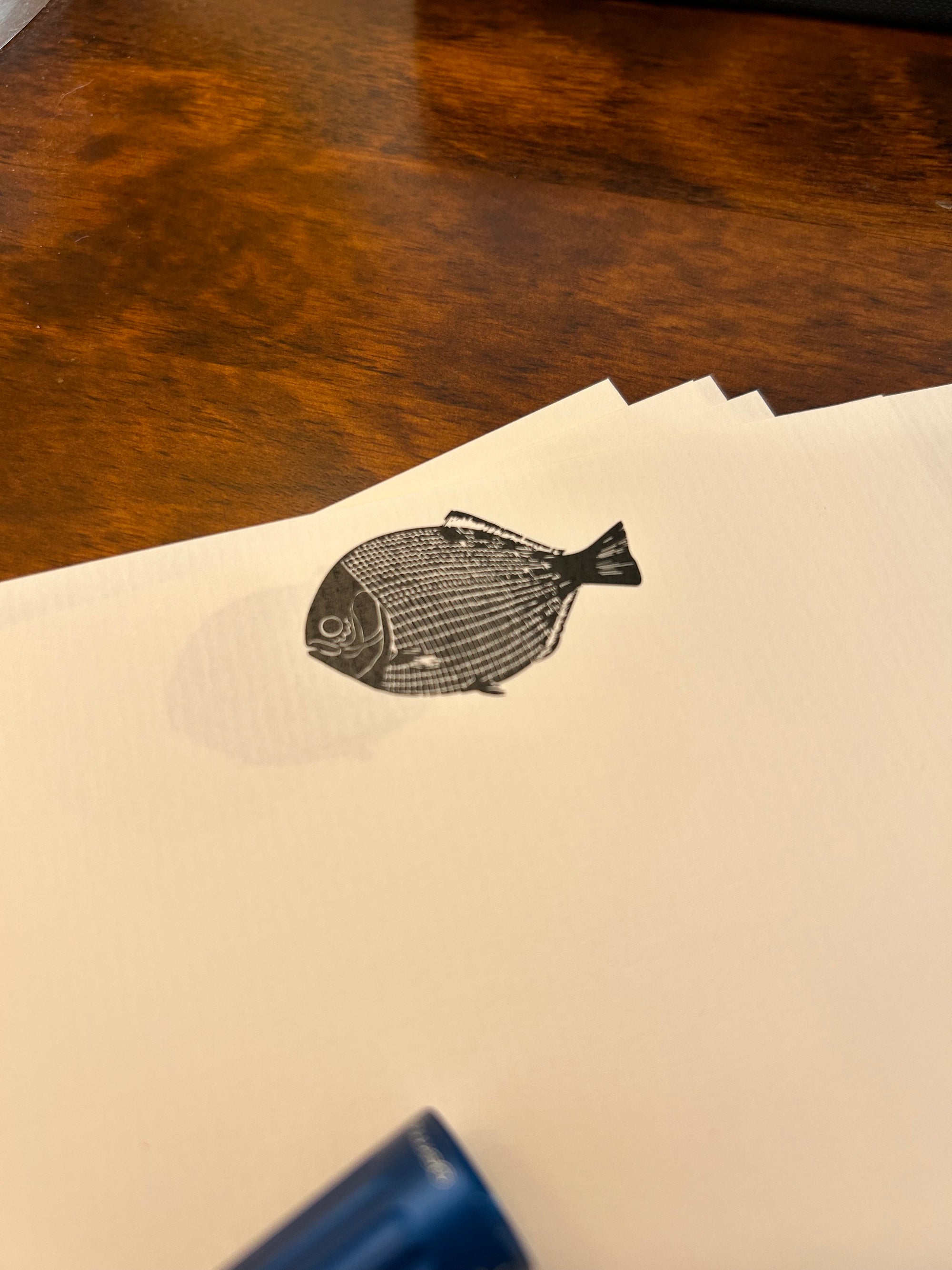 a piece of paper with a drawing of a fish on it