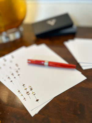 a pen and some papers on a table