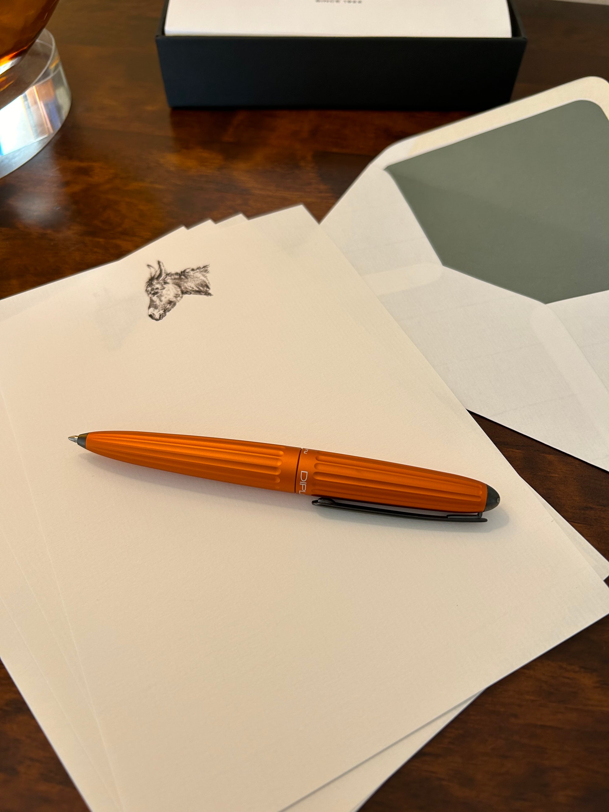 a pen sitting on top of a piece of paper