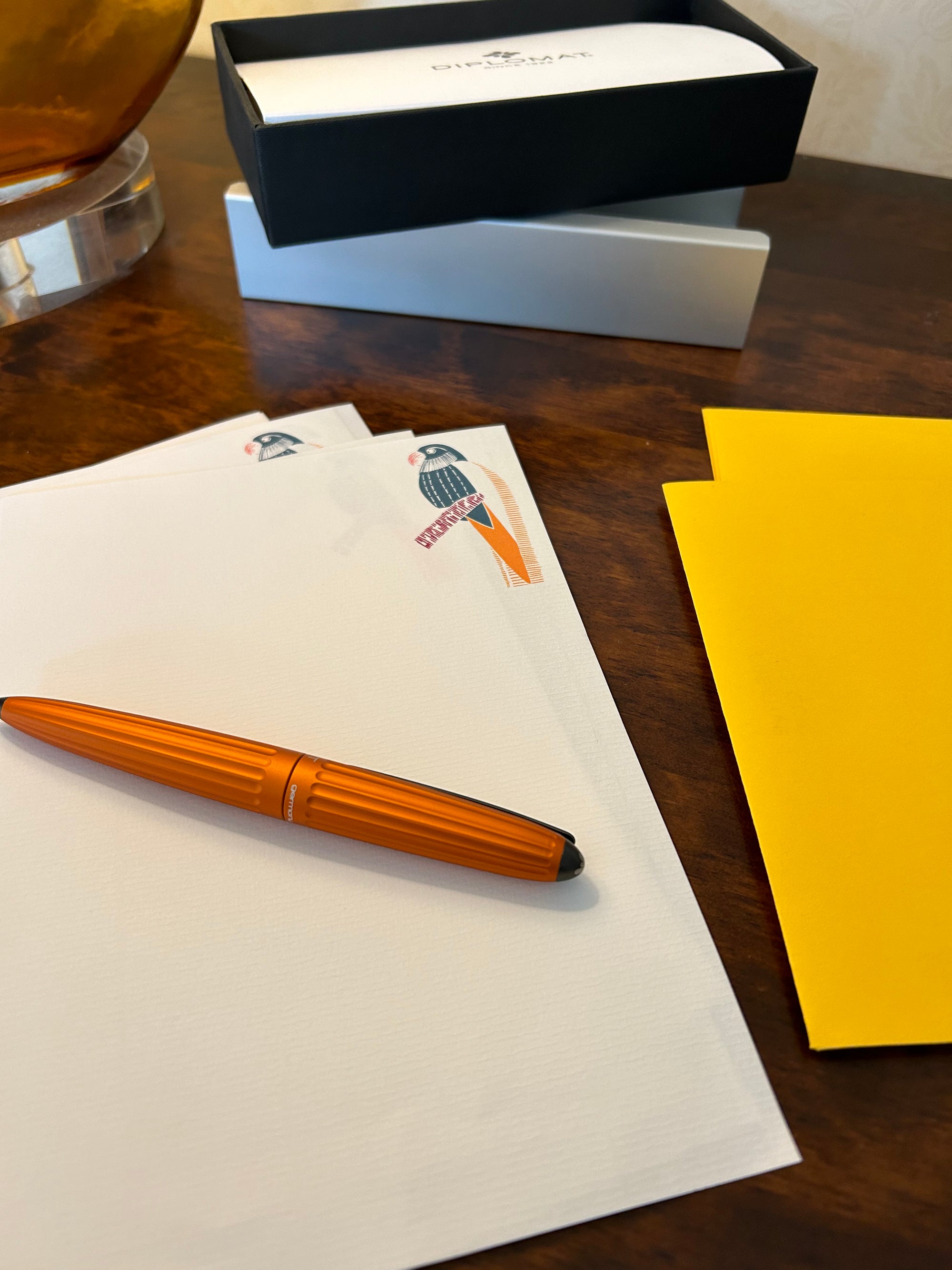 a pen sitting on top of a piece of paper