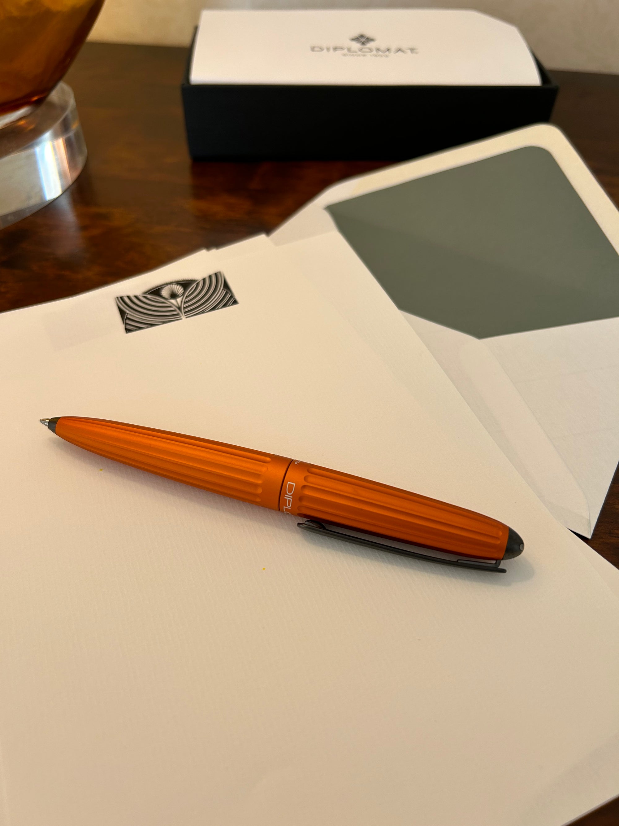 a pen sitting on top of a piece of paper