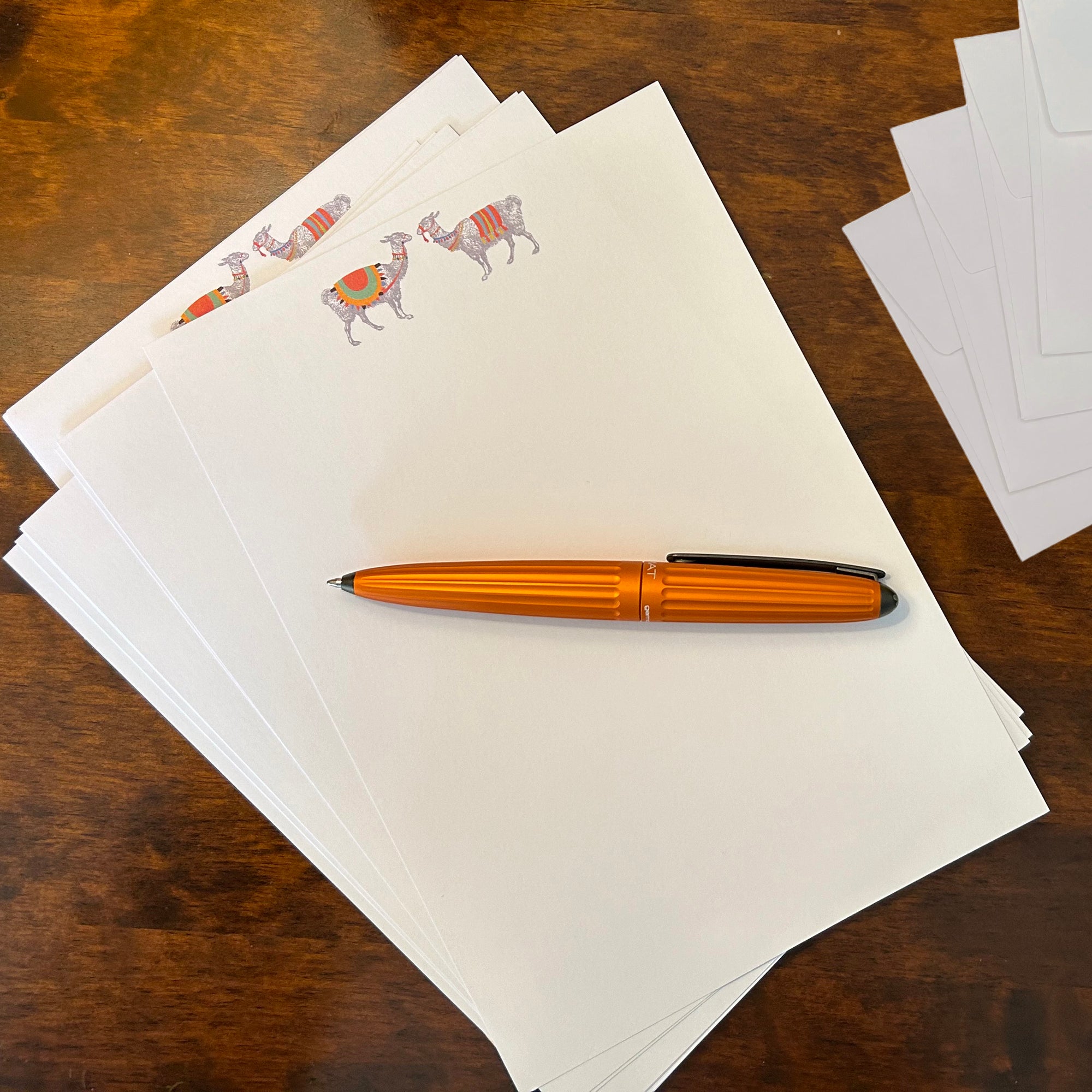 a pen sitting on top of a pile of papers